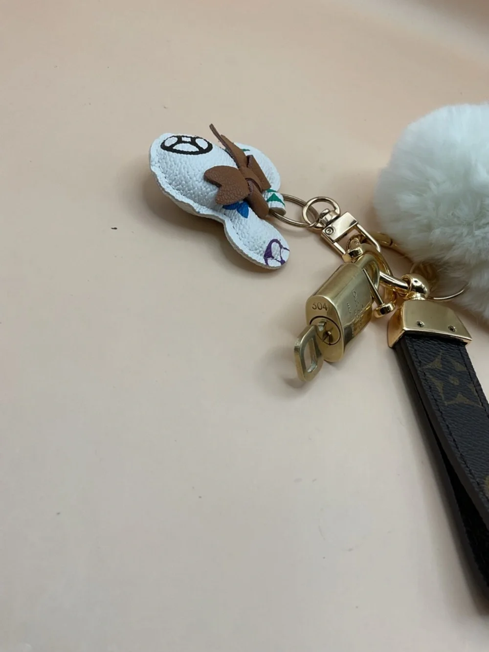 Monogram Leather Strap Keychain with Louis Vuitton Gold Lock and White Pom Pom - Picture 3 of 5